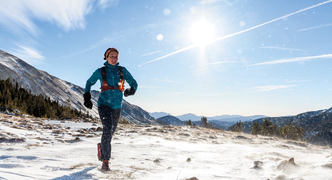 Jenn Shelton enjoys the ups and downs of a snowy trail run in the Indian Peaks, Colorado.