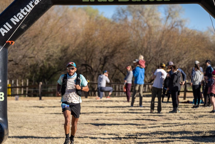 A runner comes through an aid station