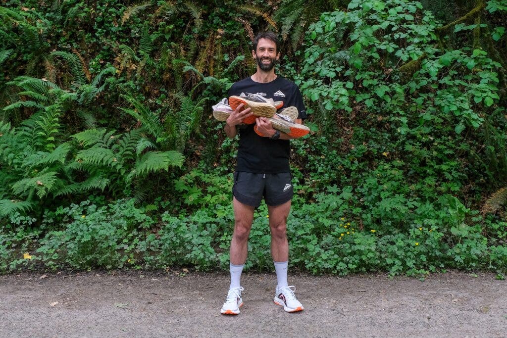 Tyler Green with pile of Nike Zoom X Ultrafly shoes