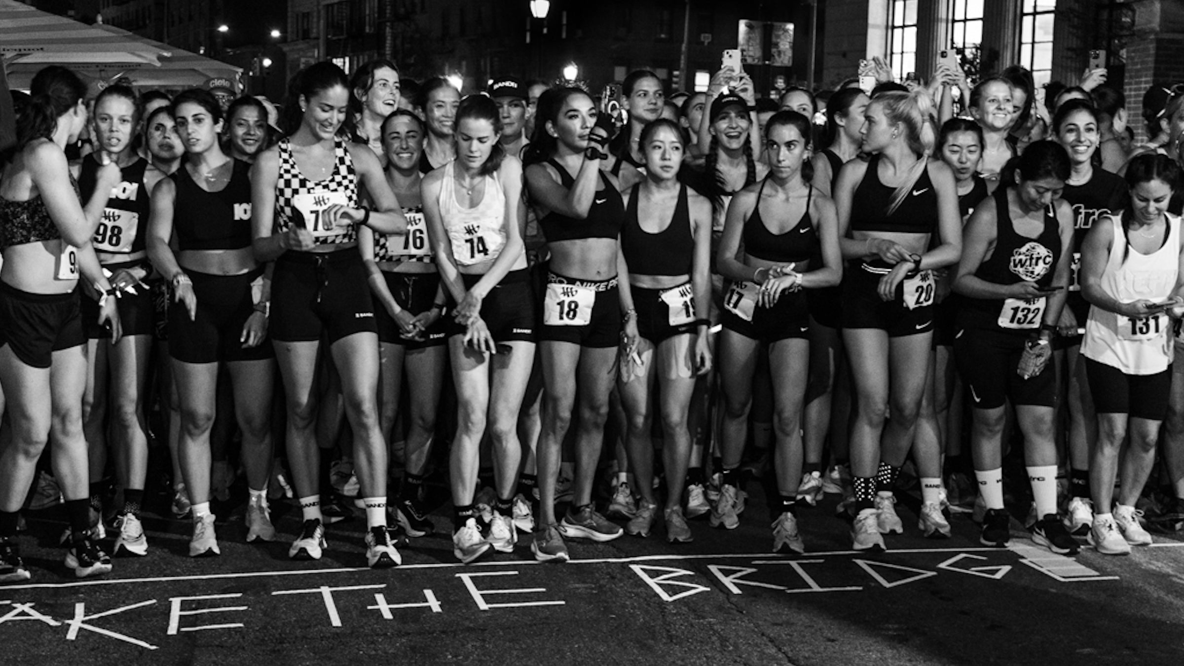 women line up for a night street race in NYC