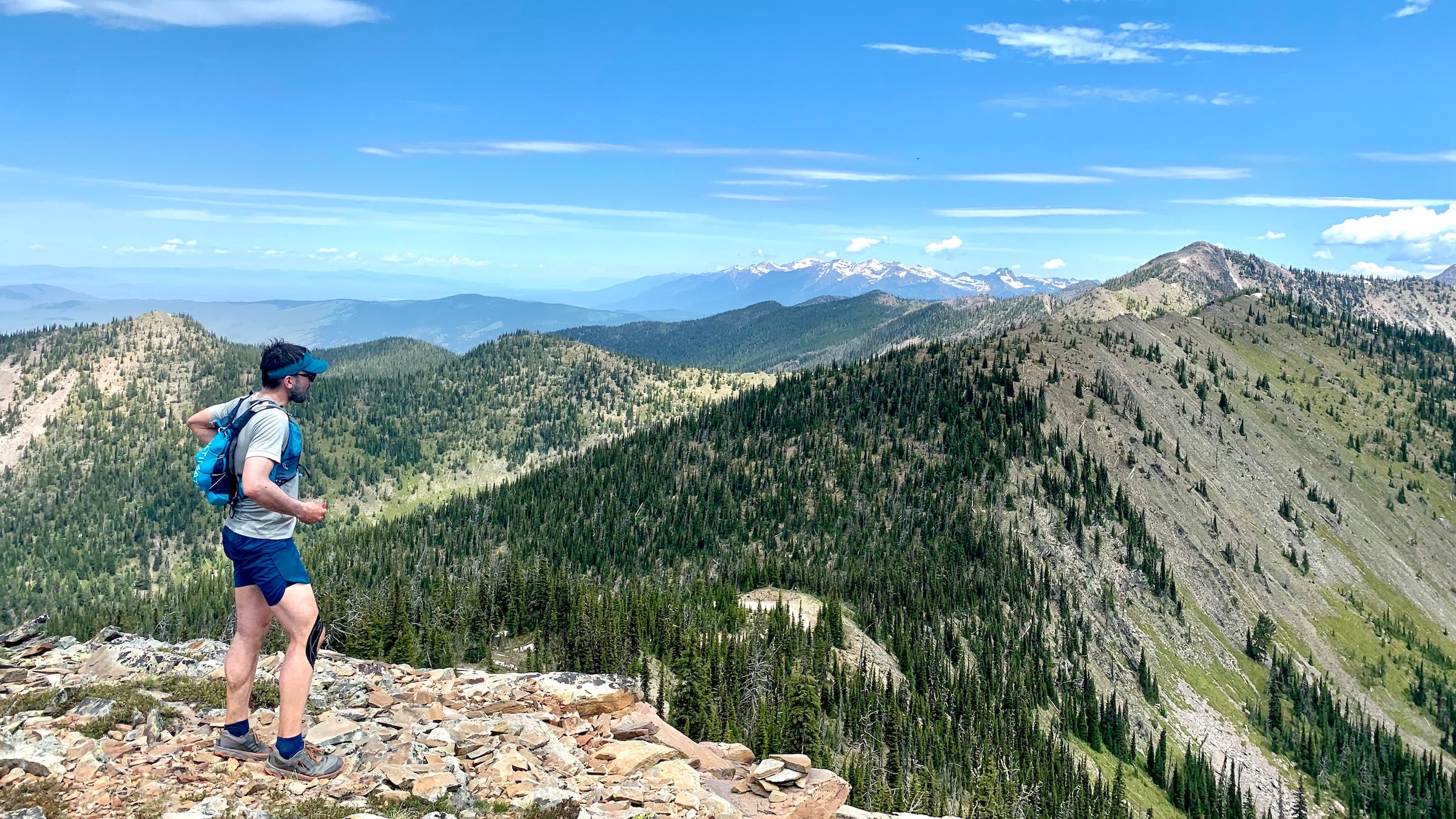 A man running in the mountains in Montana