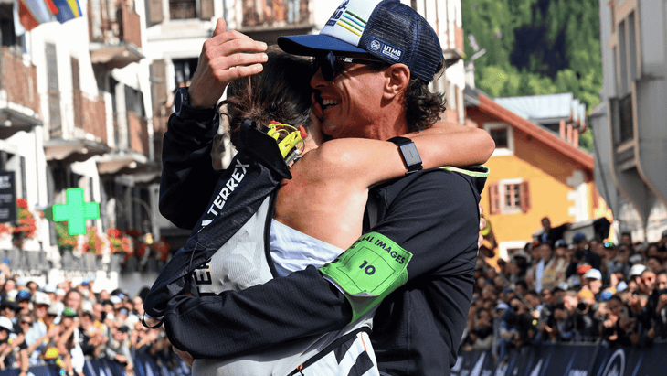 Ruth Croft caught in an embrace at the finish line of UTMB.