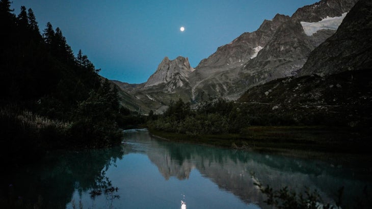 A serene Lac Combal at 68K of the UTMB Mont-Blanc course where Courtney Dauwalter, Vincent Bouillard, and Rod Farvard DNFed in 2026.