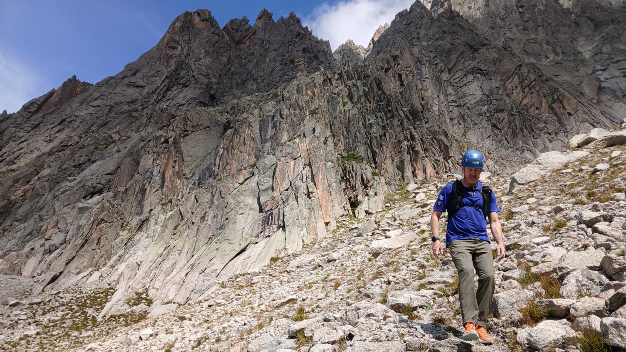 Tester clinbing down rock scramble wearing The North Face Offtrail Ultra trail running shoe in the Swiss Alps