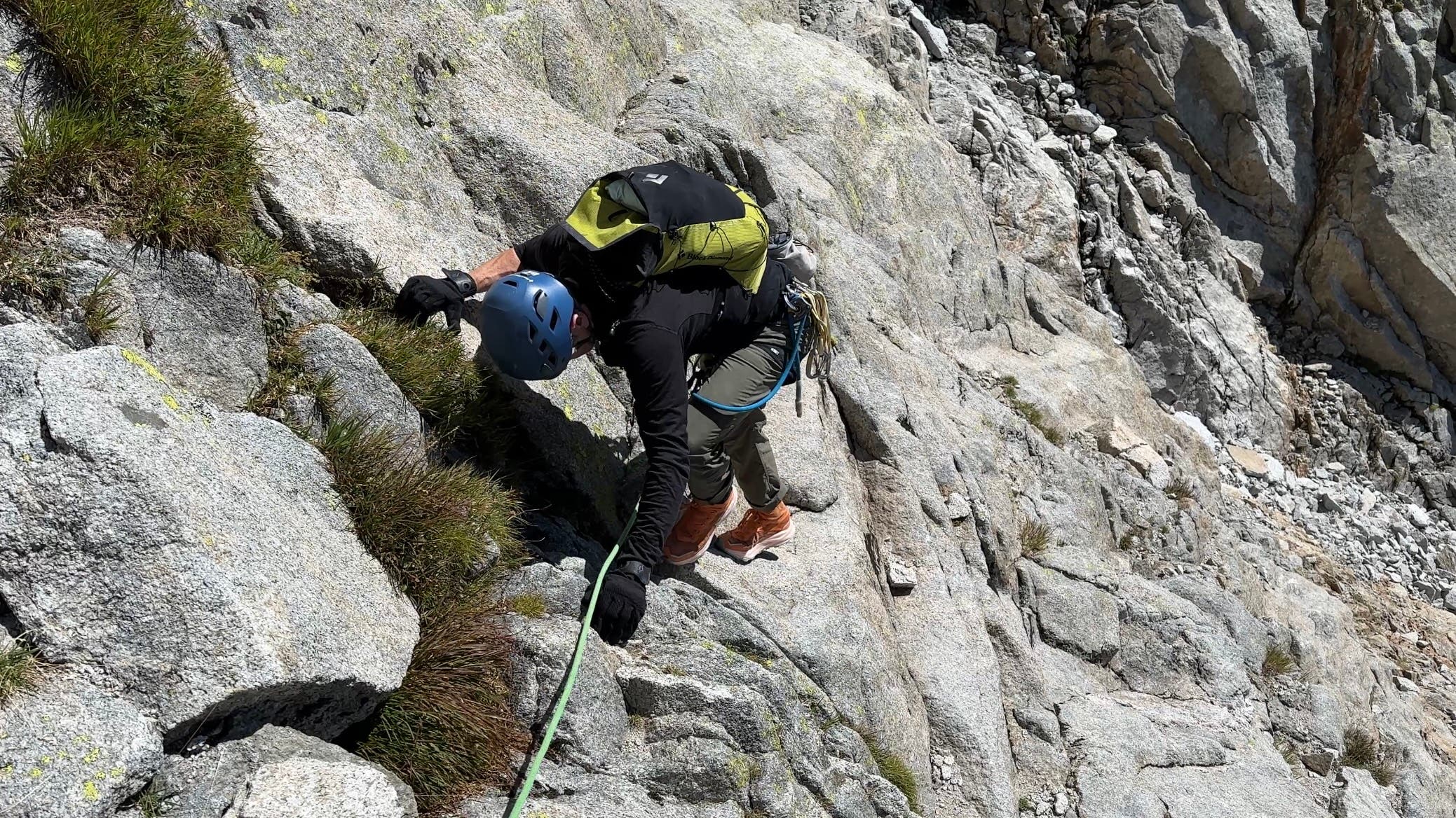 climber on a rock face wearing The North Face Offtrail Ultra